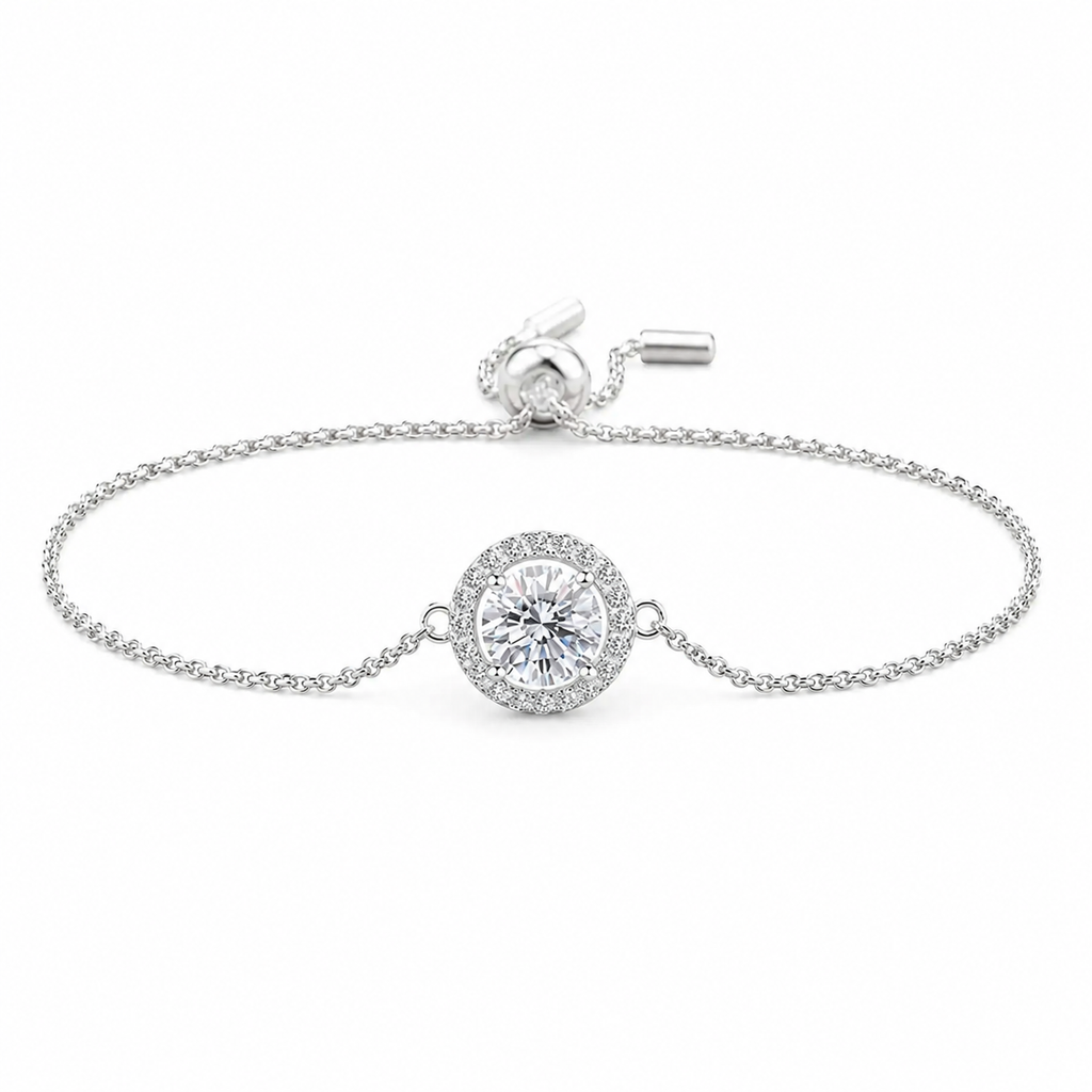 925 sterling silver adjustable slider bracelet featuring a round brilliant cubic zirconia center surrounded by a sparkling halo on a delicate chain, displayed on a pure white background. Elegant minimalist bracelet for weddings, bridesmaids, and everyday wear.