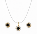 Black halo jewelry set featuring a sterling silver curb chain necklace with a round black gemstone pendant and matching halo stud earrings on a pure white background.