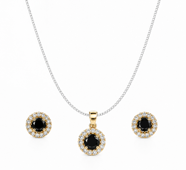 Black halo jewelry set featuring a sterling silver curb chain necklace with a round black gemstone pendant and matching halo stud earrings on a pure white background.