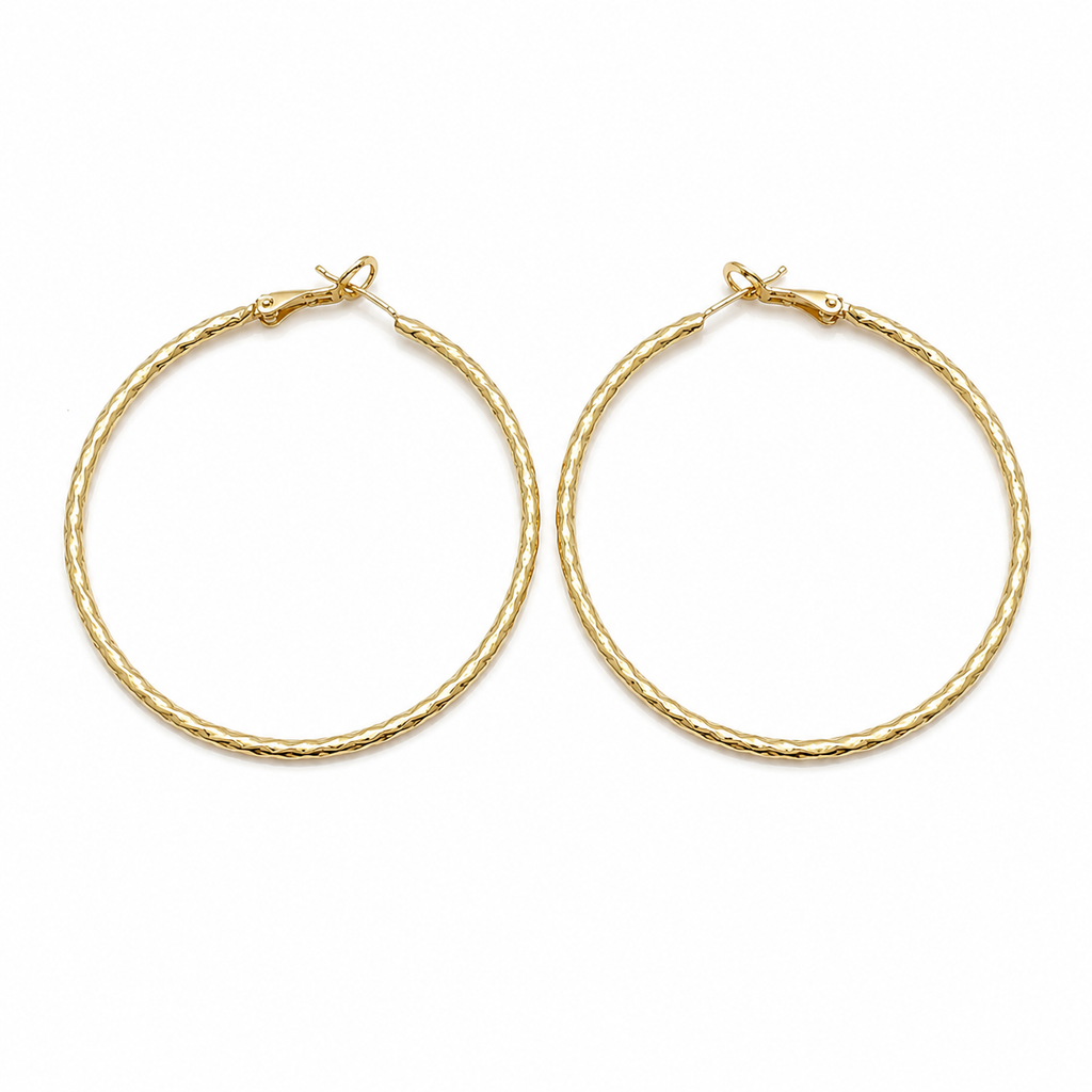 Pair of large gold filled diamond cut hoop earrings on a pure white background. Lightweight textured hoops with secure hinged closure, polished finish, and classic everyday design.