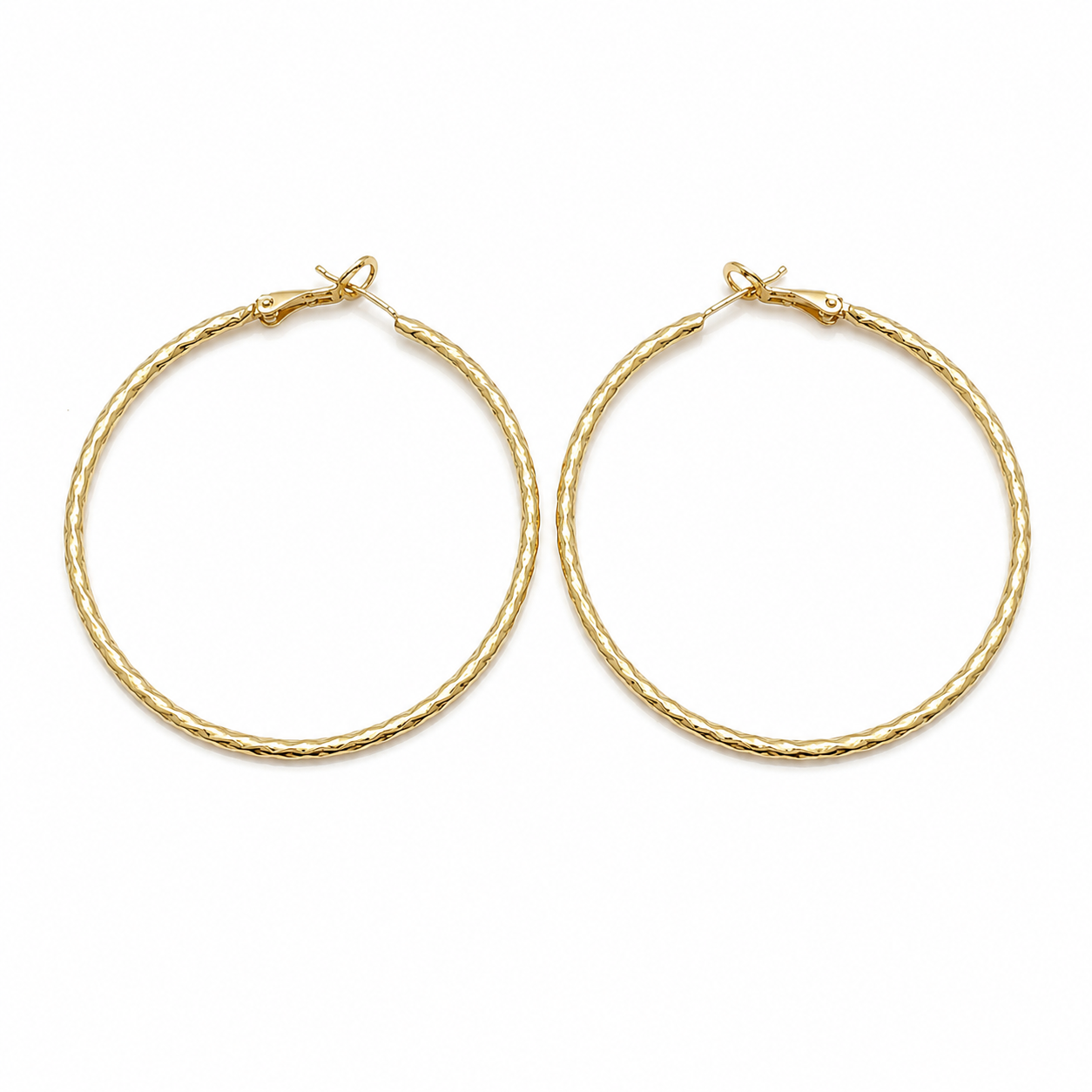 Pair of large gold filled diamond cut hoop earrings on a pure white background. Lightweight textured hoops with secure hinged closure, polished finish, and classic everyday design.