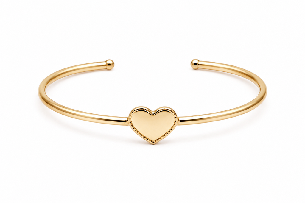 Polished gold heart cuff bracelet with an open bangle design displayed on a pure white background in a centered front view.