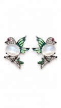 Silver moonstone bird stud earrings with hand-painted mint green enamel wings, cubic zirconia details, and crystal leaf accents, photographed on a white background.