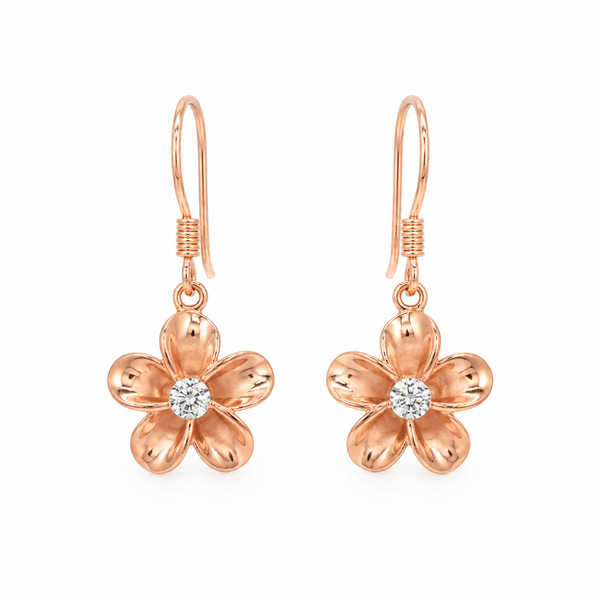 Rose gold plumeria flower drop earrings featuring polished five-petal blooms with sparkling clear center stones. The earrings hang from delicate fishhook wires and are displayed symmetrically on a pure white background, highlighting their tropical-inspired design and warm rose gold finish.