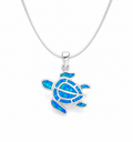 Sterling silver sea turtle pendant necklace with brilliant blue opal inlay on a polished silver chain, inspired by coastal elegance and everyday luxury.