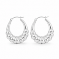 Pair of polished sterling silver chunky ribbed hoop earrings standing upright on a pure white background with a modern sculptural design.