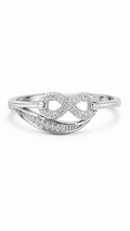 Sterling silver infinity ring with sparkling diamond accents and curved pavé design, photographed on a clean white background.