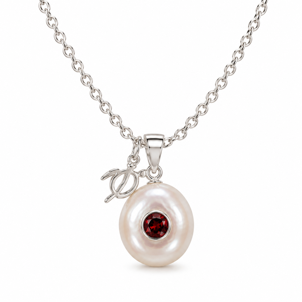 Sterling silver Birthstone Turtle Necklace featuring a genuine pearl and January garnet birthstone with turtle charm.