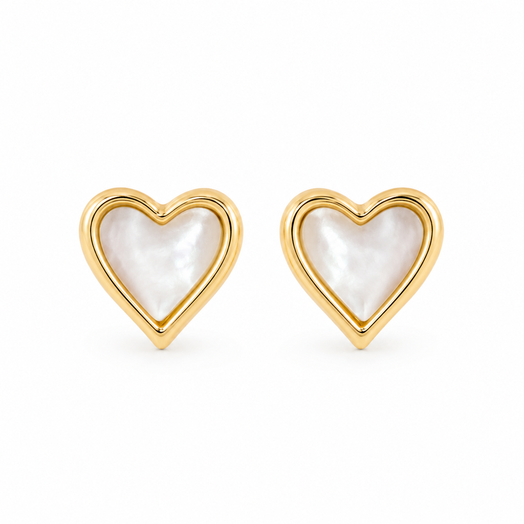 Heart-shaped mother of pearl stud earrings framed in polished gold-plated sterling silver on a clean white background.